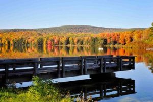Spectacular fall foliage reflects on Hills Creek Lake, Wellsboro, PA