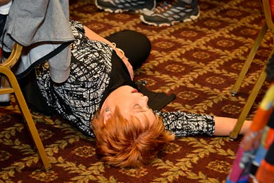 A performer playing dead on the floor