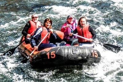 Raft full of people on a river