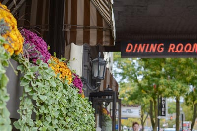 Flower box detail with dining room sign.