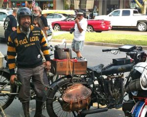 Shinya Kimura arrives at the Penn Wells on his 1915 Indian Twin motorcycle during the 2012 cross-countryCannonball.