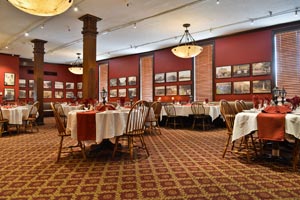 Carpeted traditionally decorated hotel dining room.