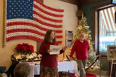 Ceremony in front of historic glass bulb flag