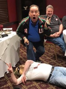 A man acting surprised on finding a dead character