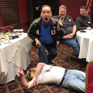 A man acting surprised on finding a dead character