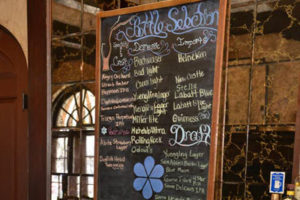 Bar specials on a chalkboard at a bar