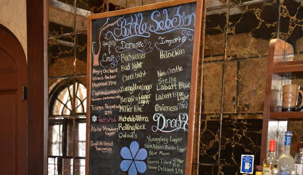 Bar specials on a chalkboard at a bar